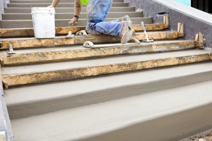 Henderson Masonry & Construction mason building cement steps.